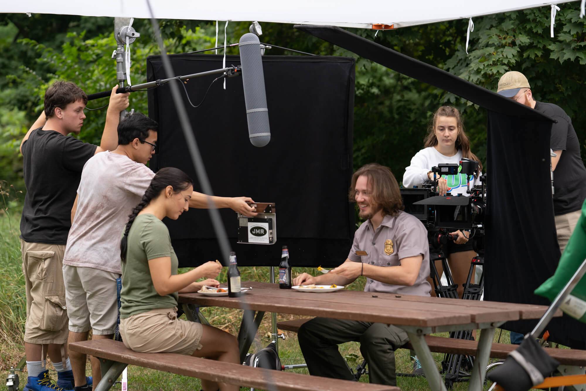 Members of the Summer Film Project crew work on a scene at Ottawa County's Hager Park.